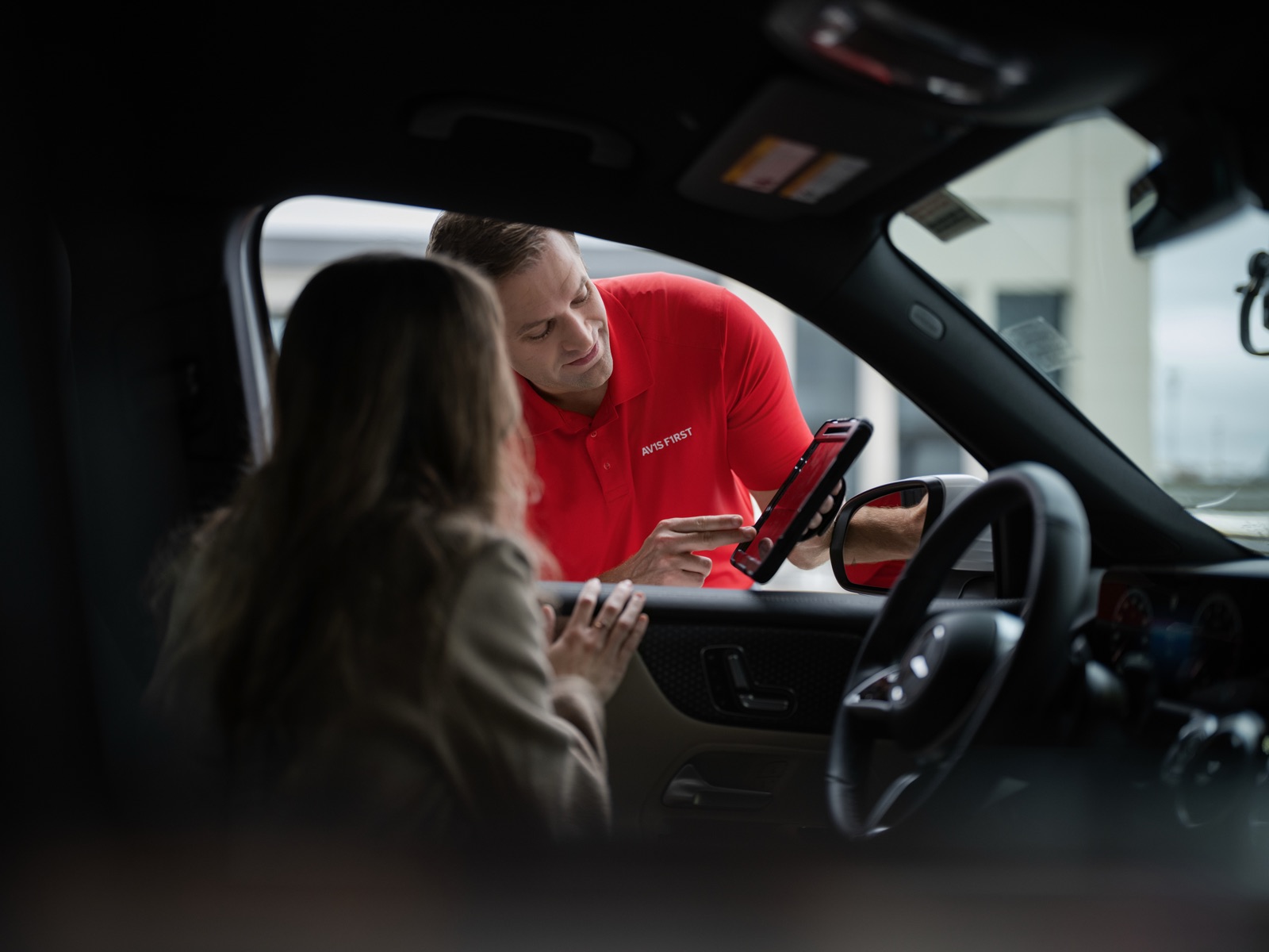 Inside vehicle — customer check-in with Avis agent