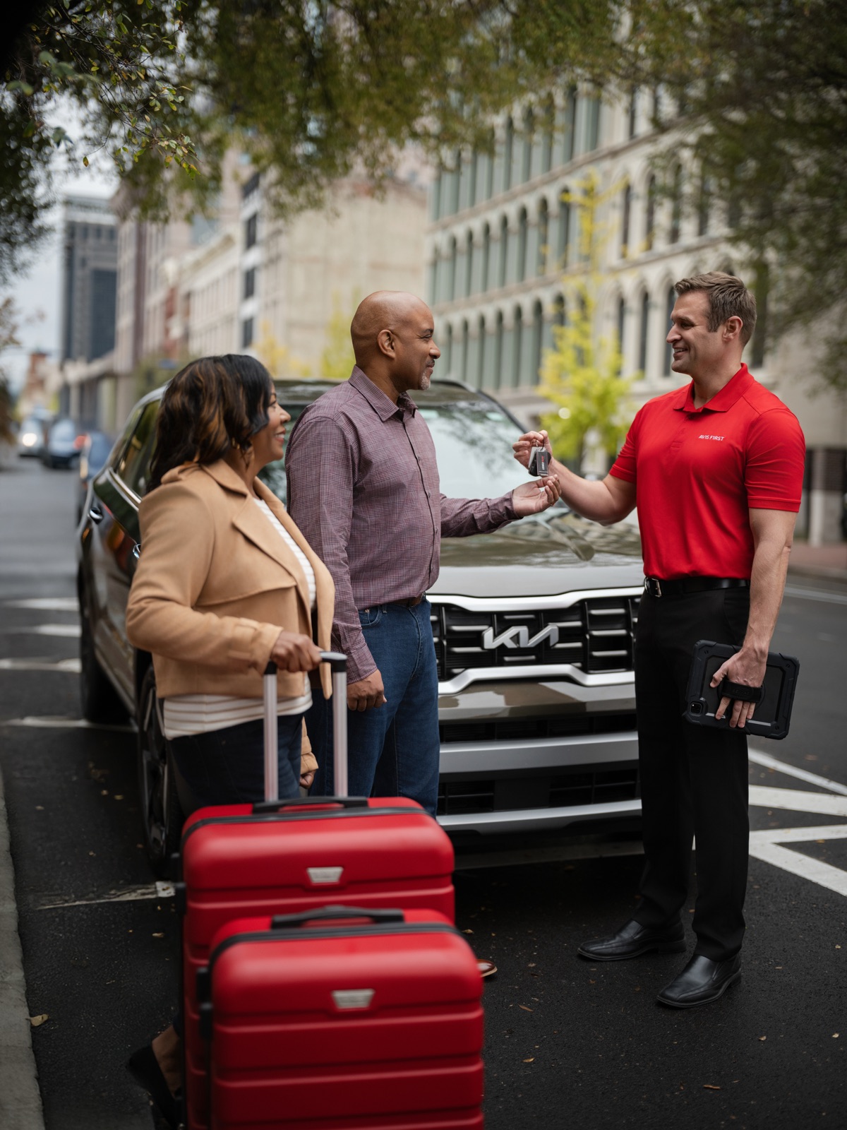 Avis employee walking — urban backdrop