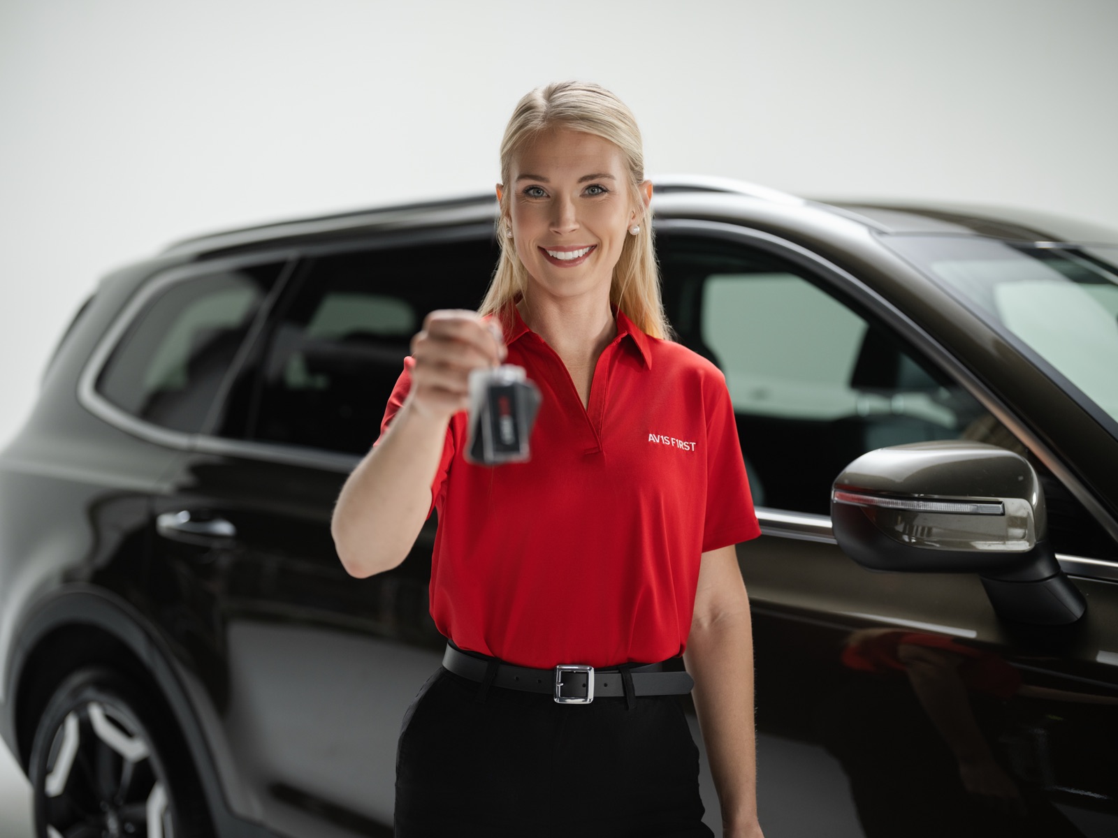 Avis employee smiling — environmental portrait