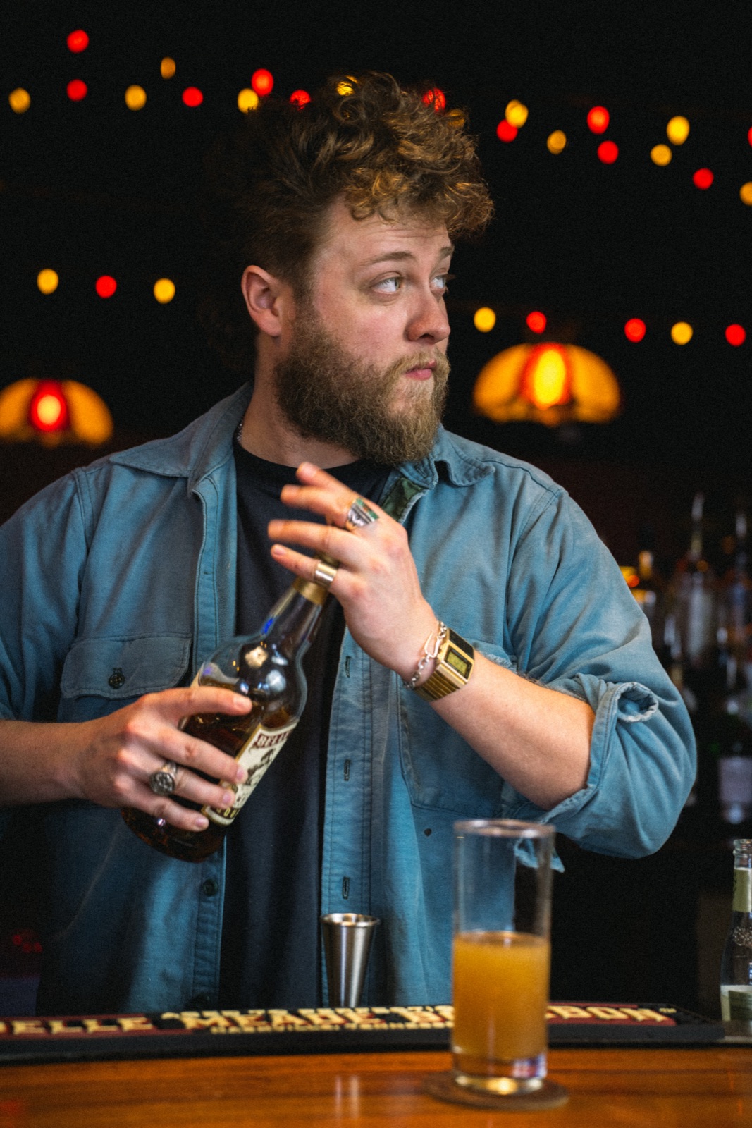 Bartender portrait — warm bar ambiance