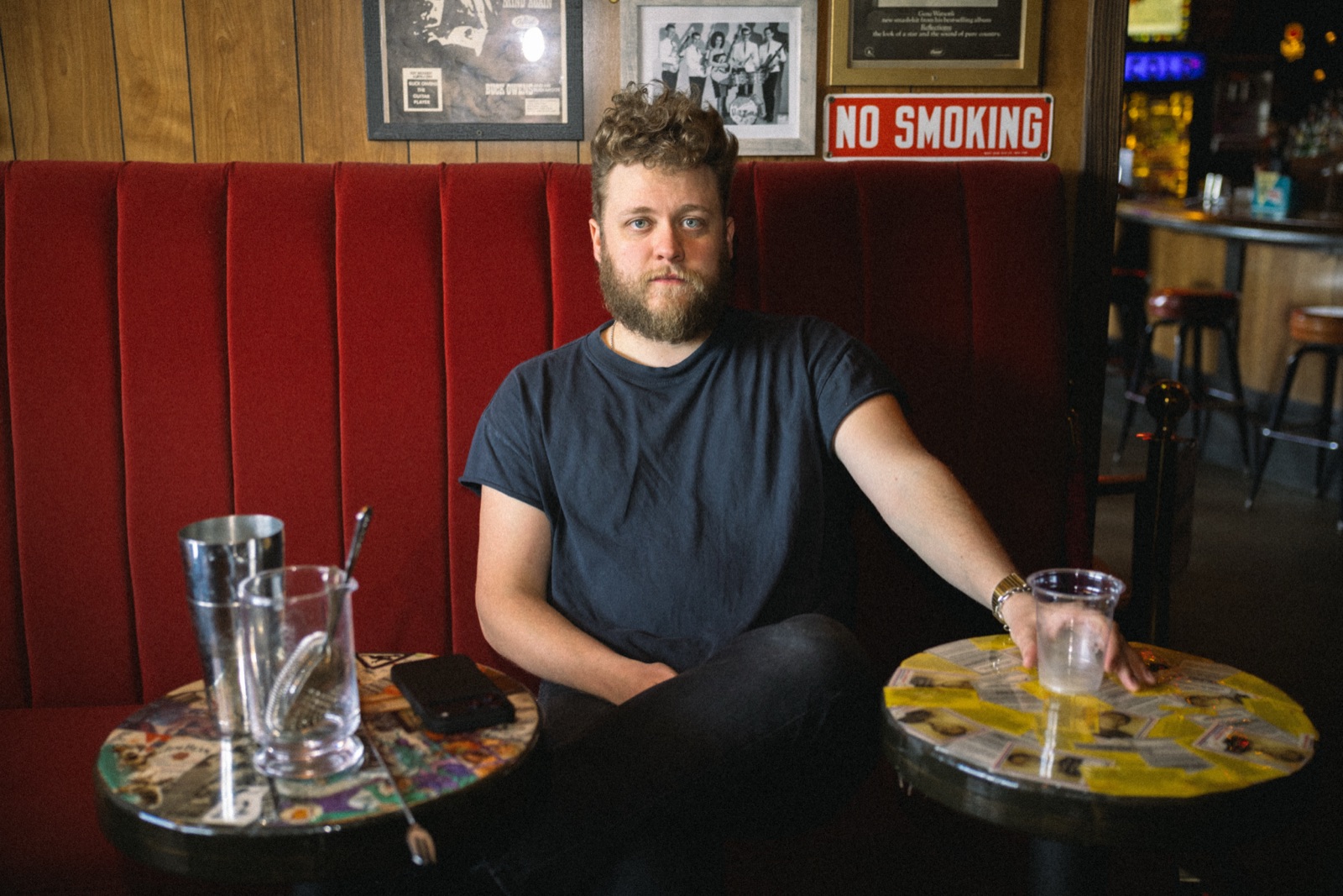 Man at bar booth — portrait